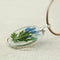 FM FM42 Pressed blue dried flower and green leaf round pendant necklace FN4004, metallic, gemstone free