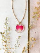 Preserved wild flower rose heart pendant