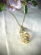 Pendant with abstract figure in resin and real flowers. Forget-me-not flowers, queen's lace. Woman face resin necklace