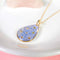 Gold forget-me-not necklace, real pressed flower teardrop pendant, handmade resin jewelry, blue forget me nots, dried botanical necklace